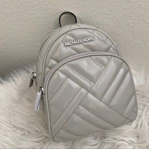 Firm✨Michael Kors abbey xs Minnie backpack Xbody